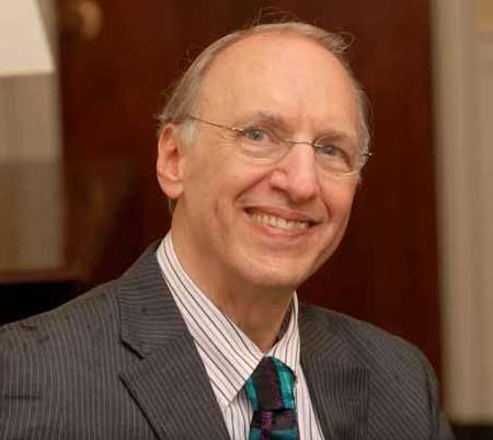 Photo of Bill Meyer smiling in formal suit and tie